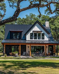 a large house with lots of windows on the roof