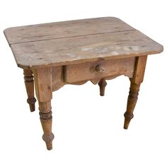 an old wooden table with two drawers and one drawer on the top, against a white background