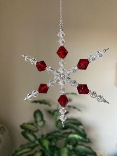 a snowflake ornament hanging from a ceiling