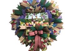 a wreath made out of paper with pictures on it