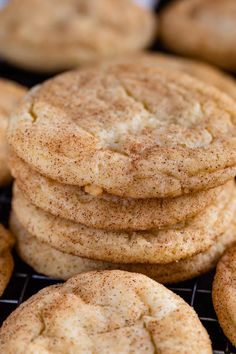 a pile of cookies sitting on top of a cooling rack