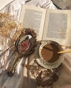 an open book with a magnifying glass next to it