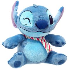 a blue stuffed animal with a red and white striped tie around it's neck