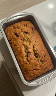 a loaf of chocolate chip banana bread in a pan