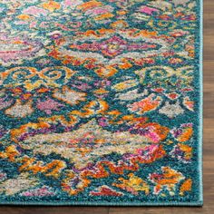 an area rug with colorful flowers on it