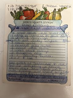 an old recipe book with writing on it and vegetables in a blue dishwasher