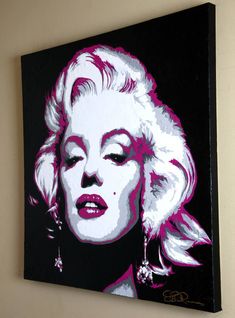 a painting of marilyn monroe on a wall in pink and black with white furnishing