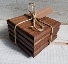 a stack of wooden coasters tied with twine