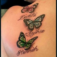 the back of a woman's shoulder with three butterflies and words written on it