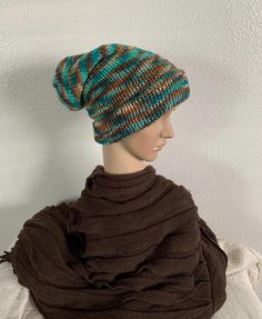 Super warm winter hat that can be worn extra slouchy with the brim pulled down. Made with an acrylic blended yarn. Size: OSFM Colors: Brown, Tan, Teal Hand Wash Cold, Air Dry Flat Fall Acrylic Beanie Hat, Casual Brimmed Bonnet One Size, Casual Slouchy Bonnet For Cold Weather, Casual One Size Brimmed Bonnet, Casual One-size Brimmed Bonnet, Winter Acrylic Hat One Size, One Size Acrylic Winter Hat, Warm One-size Beanie Bonnet, Warm Acrylic Beanie, One Size Fits Most