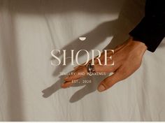 a person's hand with a ring on it and the words shore jewelry and meaningss