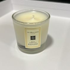 a candle sitting on top of a white table