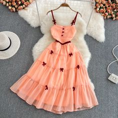 Cute Pink A-line Mini Dress, Elegant Pink Knee-length Sundress, Orange Sleeveless Mini Dress For Summer, Spring Orange A-line Mini Dress, Orange A-line Summer Dress, Pink Sleeveless Mini Sundress, Pink Sleeveless Sundress Mini Length, Peach Sleeveless Sundress, Sleeveless Apricot Dress For Summer