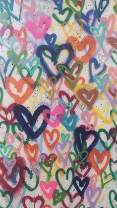 an abstract painting with many different colored hearts on it's sides and the words love spelled