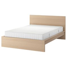 an image of a bed with no sheets on it