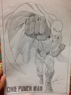 someone holding up a drawing of a punch man