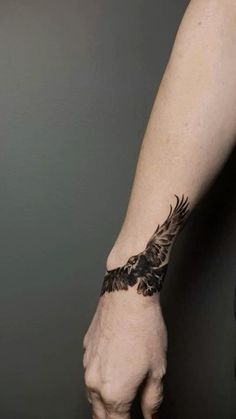 a man's arm with a tattoo on it and an eagle in the middle