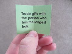 a person holding up a piece of paper that says trade gifts with the person who has the largest hair