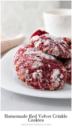 homemade red velvet crinkle cookies on a white plate with a cup of coffee in the background