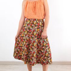 Amazing vintage 1970's Red yellow orange floral a line skirt with mod style. This vintage a line high waist skirt is circle shape and it has 70s fashion for daily wearing. The mod floral skirt with midi length is polyester fabric in excellent vintage conditions with side zip and hook and eyes closure, but it hasn't labels. The size skirt is Medium, the waist contour fit is 27,1 inches (69 cm) ** MEASURES FLAT ** Waist 13,5 in // 34,5 cm Hip - Free Length 27,5 in // 70 cm Reference: Model size S Bohemian Midi Skirt With Floral Print, Orange Flared Skirt For Spring, Flowy Orange Maxi Skirt For Summer, Retro Floral Print Skirt For Summer, Retro Floral Print Summer Skirt, Retro Flared Skirt For Spring, Hippie Floral Print Flowy Skirt, Orange Relaxed Flared Skirt, Orange Midi Skirt For Spring