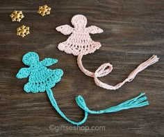 crocheted flowers and tassels sitting on a table next to each other