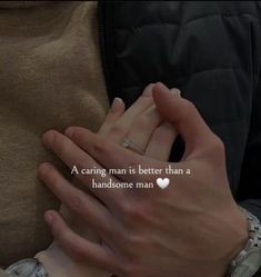 two people holding hands with the words a caring man is better than a handsome man