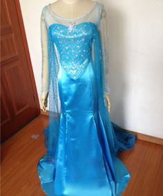 a mannequin dressed in a blue gown