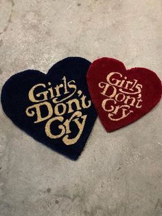 two heart shaped rugs that say girls don't cry