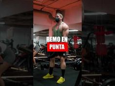 a man standing in front of a gym machine