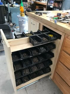 a workbench with lots of drawers and tools