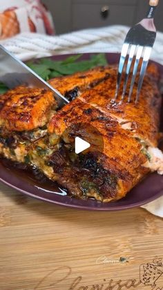 a person is cutting into some food on a plate with a knife and fork in it