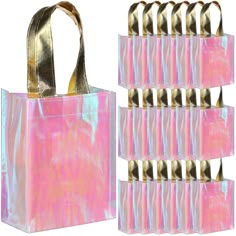 a pink bag with gold handles is next to a set of six bags that are stacked on top of each other