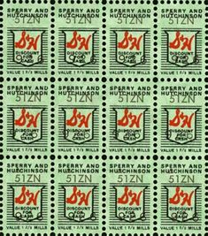 stamps with red and black numbers on them, all in different colors are shown against a green background