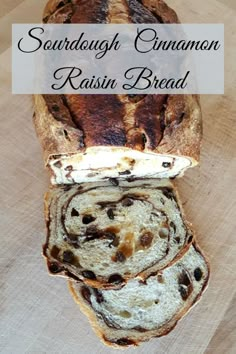 sourdough cinnamon raisin bread on a cutting board with the words sourdough cinnamon raisin bread