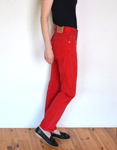 "Cool vintage red denim 451 pants by Levi's. High waisted, \"mom\" cut with straight legs. Silver rivets and buttons with signatures. Look good with cuffed legs. Buttoned up fly. White tab. Era: 90's, brand Levi Strauss Fabric: 100% cotton Condition: very good, a bit washed off Estimated size: S, will fit best a tall person (please, check the measurements) Measurements (measured flat - need to be doubled to get the circumference): Waist: 34 cm / 13,4 inches Hips: 48 cm / 18,9 inches Length: 107 Trendy Red Full-length Jeans, Relaxed Fit High Rise Red Bottoms, Red High Rise Relaxed Fit Bottoms, Red Relaxed Fit Jeans For Fall, Trendy Red Relaxed Fit Jeans, Red High Rise Jeans With Five Pockets, Red High-rise Jeans, Red High Waist Jeans With Five Pockets, Retro High Waist Red Jeans