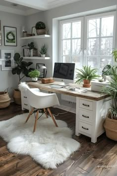 a home office with white fur rugs and potted plants