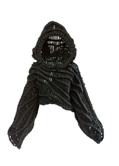 a black knitted scarf with a hood on the top, and a white background