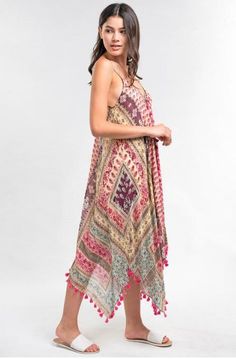 Final Sale - Get it before it's gone! For an on-point resort ensemble, reach for the Sun Kissed Pink Paisley Print Scarf Dress! Lightweight sheer dress, in hues of pink and turquoise, falls from spaghetti straps into a V-neckline into a relaxed bodice. Asymmetrical hemline with tassel trim. DETAILS & CARE Modal/Viscose. Machine wash cold. Imported. Pink V-neck Boho Dress For Beach Cover-up, Pink V-neck Boho Dress For The Beach, Sleeveless Boho Print Dress For Beach Cover-up, Multicolor Paisley Print Maxi Dress For Vacation, Pink Sleeveless Maxi Dress Beach Cover-up, Beach Sundress With Paisley Print And V-neck, Pink Paisley Print Maxi Dress For Summer, Pink Paisley Maxi Dress For Summer, Summer Paisley Print Patterned Maxi Dress