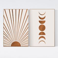 two framed art prints with the sun and moon in gold on white wall above them