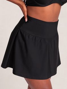 Your sunny adventure sidekick, Shapermint Essentials High Waisted Full Coverage Swim Skirt gives you the full-coverage confidence and flattering fit you deserve. Take this versatile flounce skirt style from brunch to the beach. Its wide and high-profile waistband smooths your midsection, and its built-in bikini bottom delivers maximum comfort. Pair this skirt with the Shapermint Essentials Full Coverage Halter Bikini Top and your outfit is complete! Wide Waist Band for Smoothing No Muffin Top Fl Flowy Tiered Skirt With Built-in Shorts, Flowy Skirted Swim Skirt With Built-in Shorts, Flowy Swim Skirt With Built-in Shorts, Fitted Tiered Skort With Built-in Shorts, Tiered Skirt With Built-in Shorts, Black Skirt With Built-in Shorts For Beach, Summer Skirt With Wide Waistband And Short Inseam, Summer Skirt With Wide Waistband And Short Length, Solid Color Skort With Wide Waistband