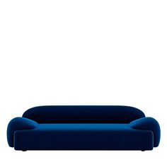 a blue couch sitting on top of a white floor