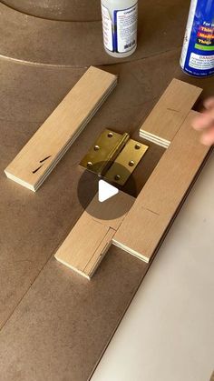 someone is working with wood and glue to make a diy door frame for a mirror