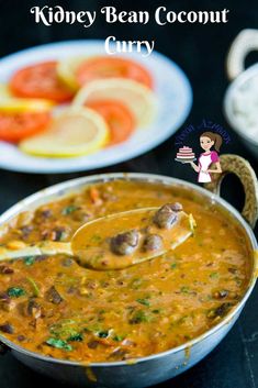 a close up of a bowl of food with a spoon in it and the words kidney bean coconut curry