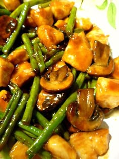 chicken, green beans and mushrooms on a plate