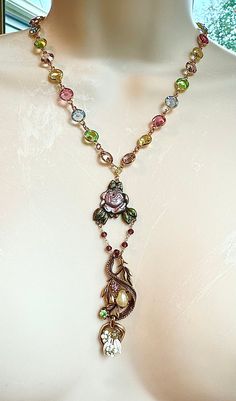 I made this upcycled vintage bits and pieces, floral, flower, garnet rosary, brass stamping, roses crystal chain necklace. It measures 20", but also has a generous extender. I made this out of lots of fun upcycled bits and pieces. Garnet Rosary, Vintage Upcycling, Bits And Pieces, Crystal Chain, Upcycled Vintage, Floral Flower, Rosary, Pendant Necklaces, Garnet