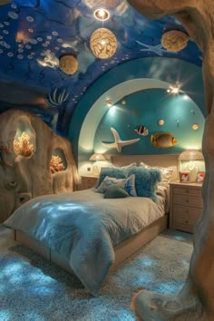 a bedroom with an underwater theme is shown