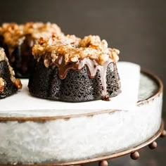 chocolate cake with walnuts and crumbs on top