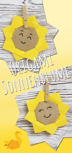 an origami sunflower is hanging on a clothesline with the words, origami sonnenburgum