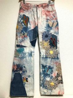 a pair of jeans with colorful patches on them