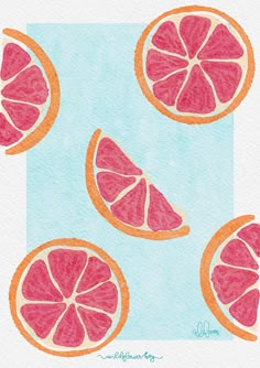 three grapefruits cut in half on a blue background with watercolor paper